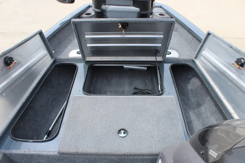 Slide: The Image of 2020 Tracker Pro Team 175 TF boat interior with open storage compartments. - 15