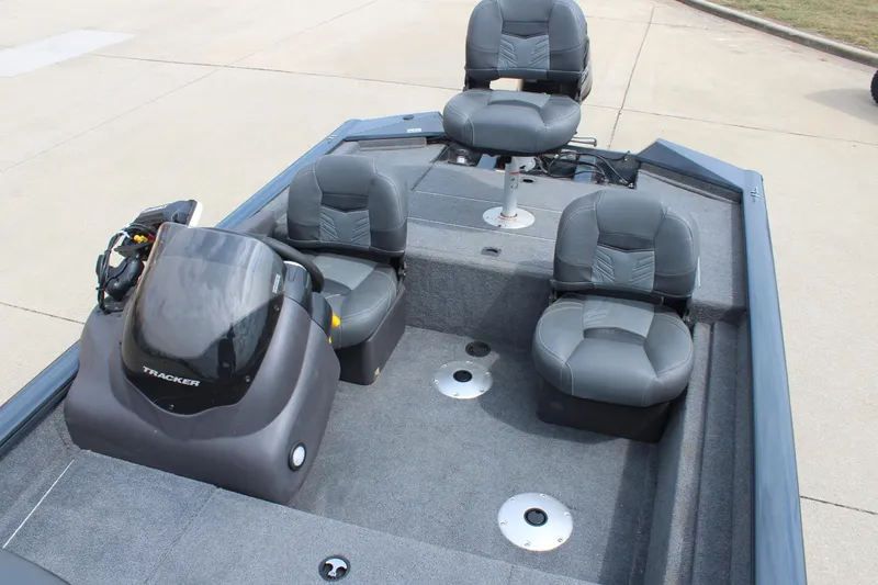 Slide: The Image of 2020 Tracker Pro Team 175 TF boat interior with gray seating and console. - 16