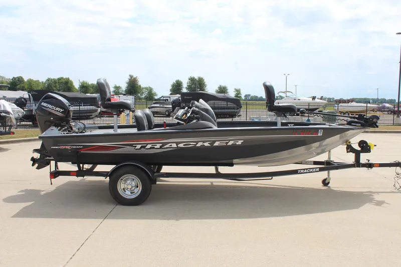 Slide: The Image of 2020 Tracker Pro Team 175 TF fishing boat on trailer, parked outdoors. - 4