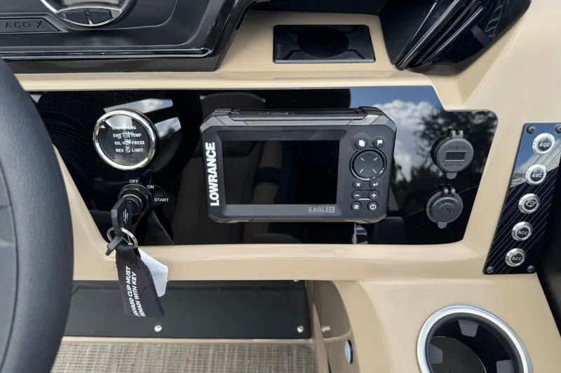 Slide: The Image of Dashboard of 2026 Viaggio Lago X22D Tritoon with Lowrance display and ignition controls. - 10