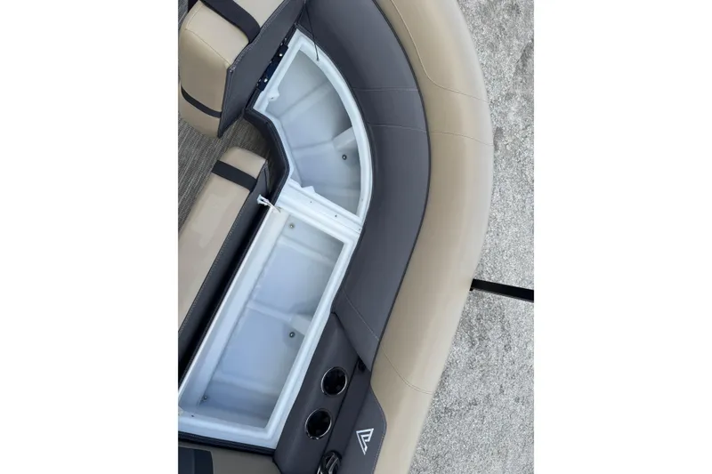 Slide: The Image of 2026 Viaggio Lago X22D Tritoon seating with storage compartment and cup holders. - 16