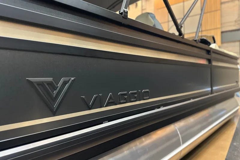 Slide: The Image of 2026 Viaggio Lago X22D Tritoon boat, sleek design with prominent logo detail. - 21