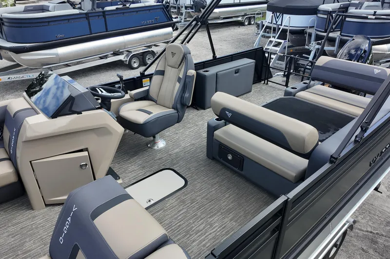 Slide: The Image of 2026 Viaggio Lago X22D Tritoon interior with modern seating and steering console. - 6