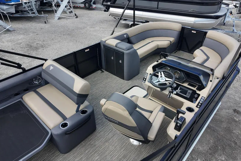 Slide: The Image of Interior of 2026 Viaggio Lago X22D Tritoon, featuring modern seating and steering console. - 7