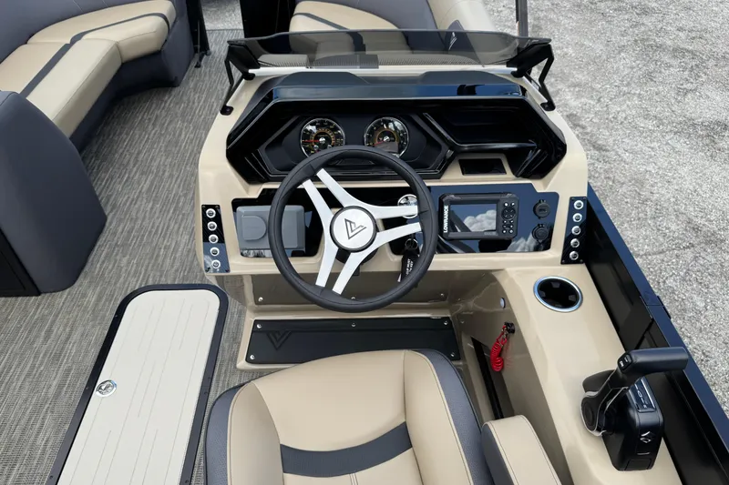 Slide: The Image of 2026 Viaggio Lago X22D Tritoon dashboard with steering wheel and control panel. - 9