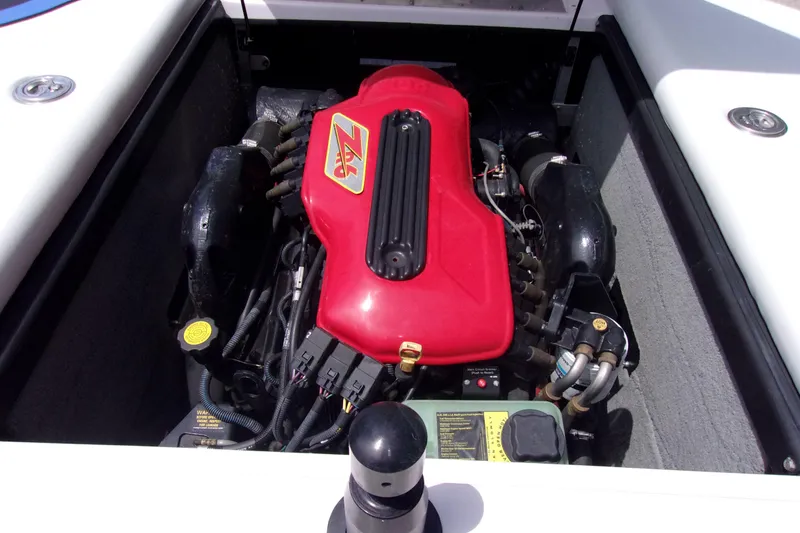 Slide: The Image of 2005 Correct Craft 210 SUPER AIR TEAM EDITION engine with red cover, detailed view. - 13