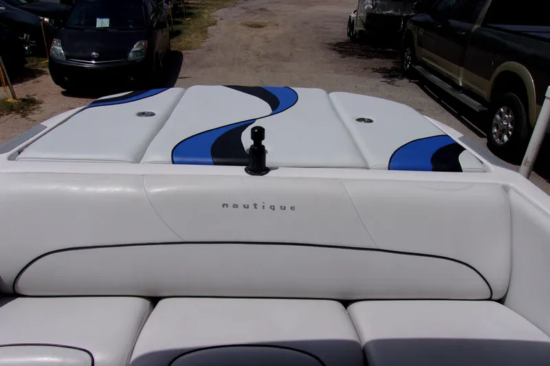 Slide: The Image of 2005 Correct Craft 210 SUPER AIR TEAM EDITION boat interior with white and blue upholstery. - 6