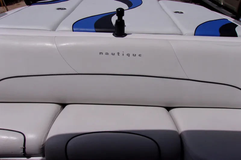 Slide: The Image of 2005 Correct Craft 210 SUPER AIR TEAM EDITION boat interior with Nautique branding. - 8