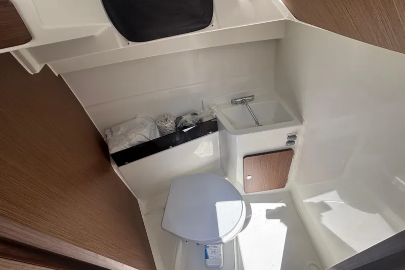 Slide: The Image of Interior of 2021 Beneteau Antares 8 boat bathroom with sink and toilet. - 12