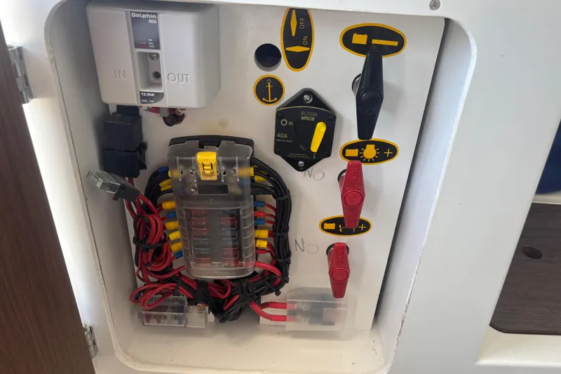 Slide: The Image of Electrical panel of a 2021 Beneteau Antares 8 boat, featuring switches and wiring. - 18