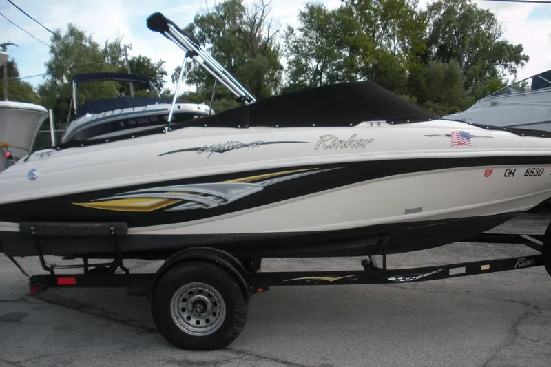 Slide: The Image of 2003 Rinker 192 Captiva Bowrider boat on trailer, parked outdoors. - 0