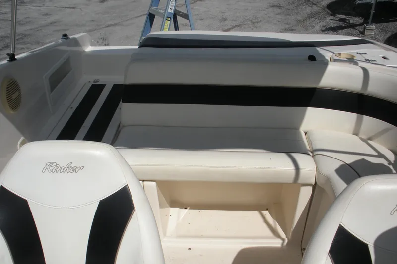 Slide: The Image of 2003 Rinker 192 Captiva Bowrider interior with white and black seating. - 11