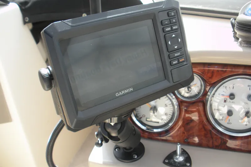 Slide: The Image of Garmin GPS on 2003 Rinker 192 Captiva Bowrider dashboard with gauges. - 6