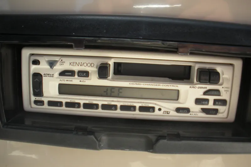 Slide: The Image of Kenwood stereo system in a 2003 Rinker 192 Captiva Bowrider boat dashboard. - 7