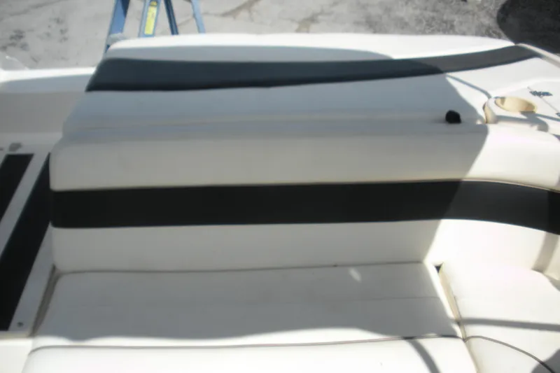 Slide: The Image of 2003 Rinker 192 Captiva Bowrider boat seat with black and white upholstery. - 9