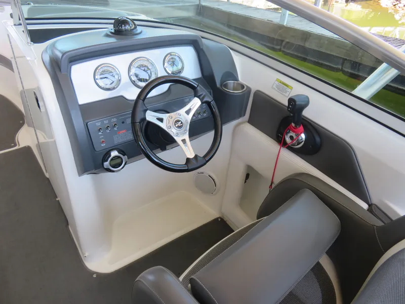 Slide: The Image of Interior view of 2011 Sea Ray 240 Sundeck helm. - 3