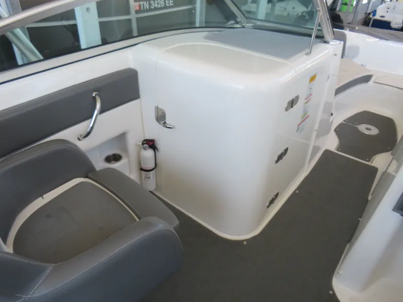Slide: The Image of Interior of a 2011 Sea Ray 240 Sundeck with seating and storage. - 4