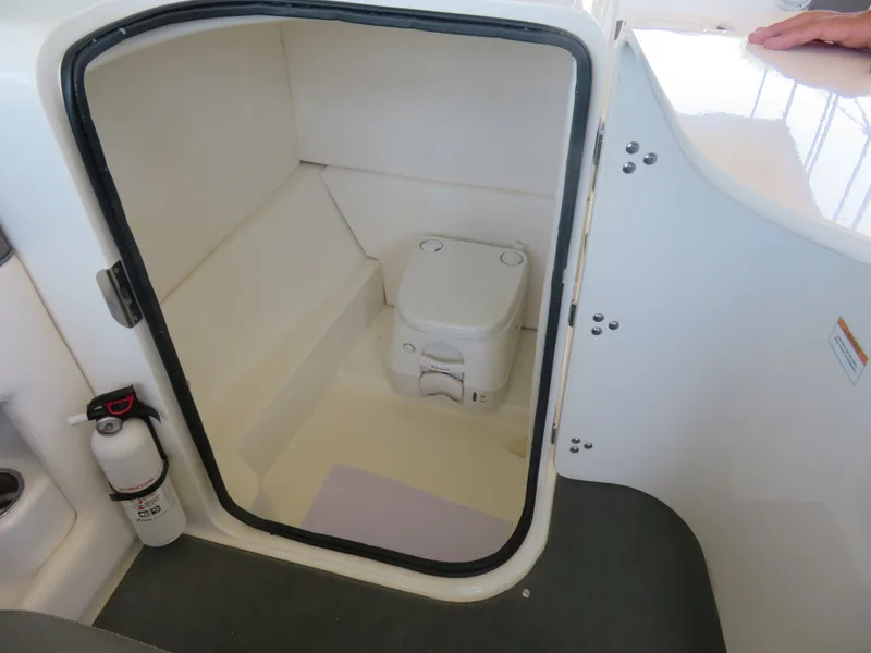 Slide: The Image of Interior of 2011 Sea Ray 240 Sundeck with toilet. - 5