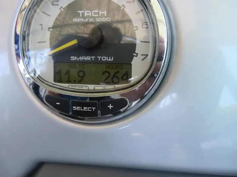 Slide: The Image of Tachometer of 2011 Sea Ray 240 Sundeck showing 11.9 volts and 264 hours. - 6