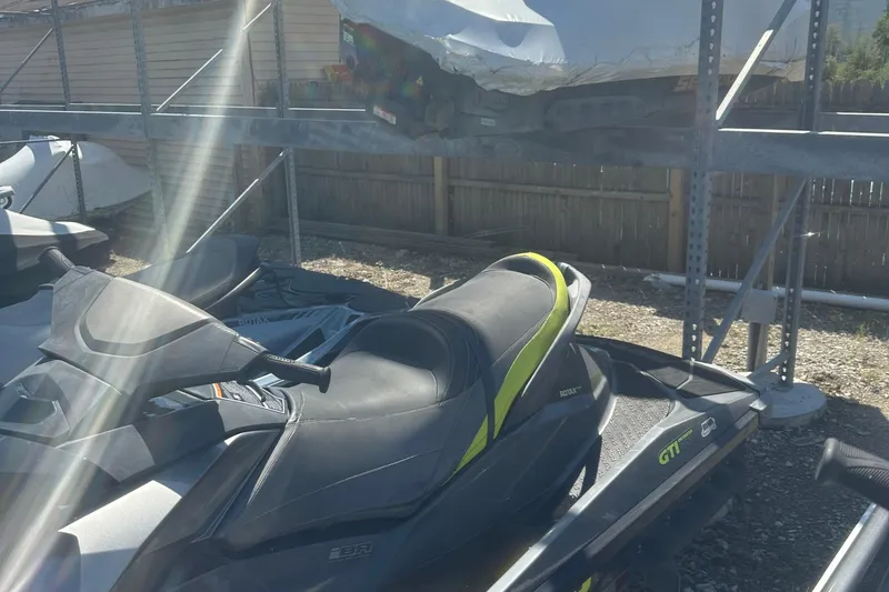 Slide: The Image of 2015 Sea-Doo GTI Limited 155 jet ski parked outdoors in sunlight. - 7