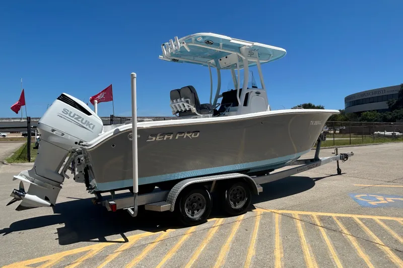 Slide: The Image of 2021 Sea Pro 239 Center Console boat on trailer in parking lot, sunny day. - 6