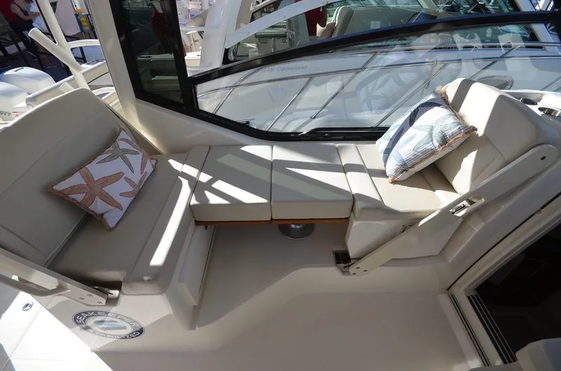 Slide: The Image of Manufacturer Provided Image: 2021 Boston Whaler 325 Conquest boat interior seating area with cushions. - 21