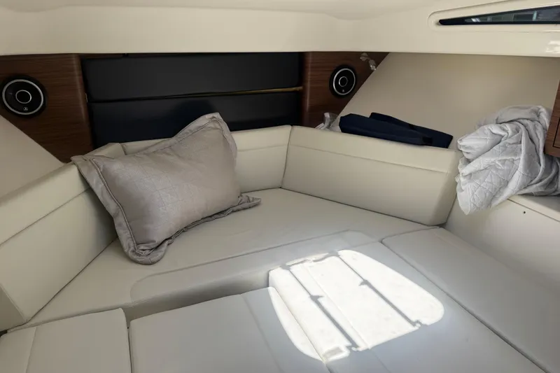 Slide: The Image of 2021 Boston Whaler 325 Conquest cabin interior with plush seating and modern design. - 3