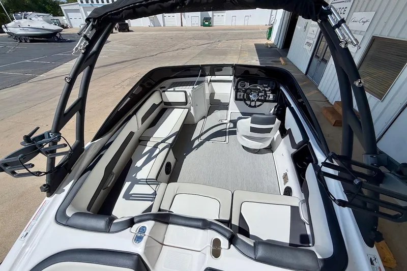 Slide: The Image of 2025 Yamaha Boats AR195 interior with sleek seating and modern dashboard design. - 11