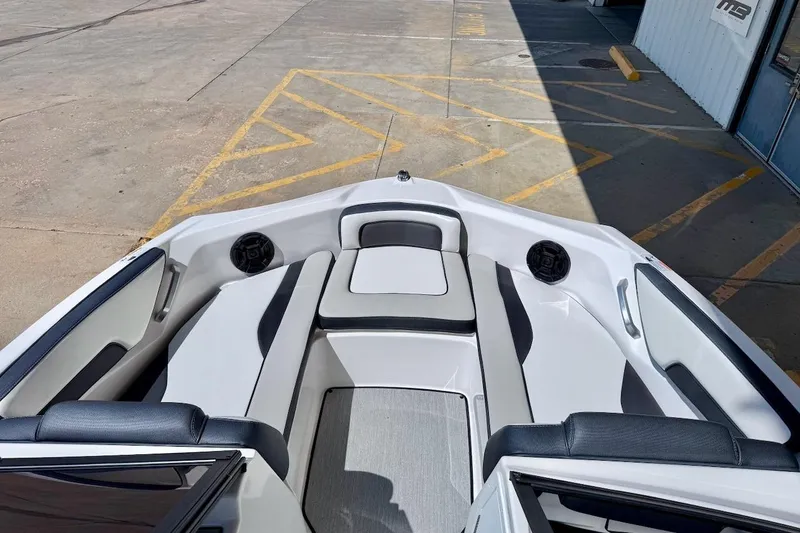 Slide: The Image of 2025 Yamaha Boats AR195 interior with sleek seating and modern design. - 14