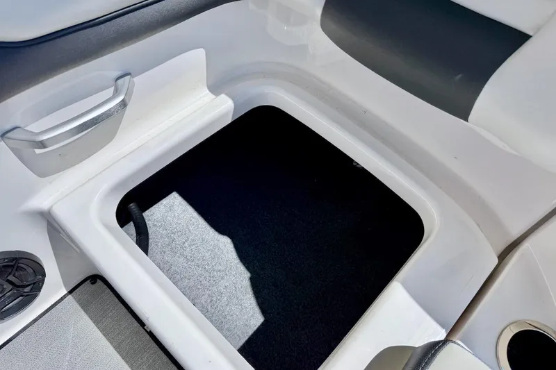 Slide: The Image of 2025 Yamaha Boats AR195 interior storage compartment with sleek design and modern features. - 21