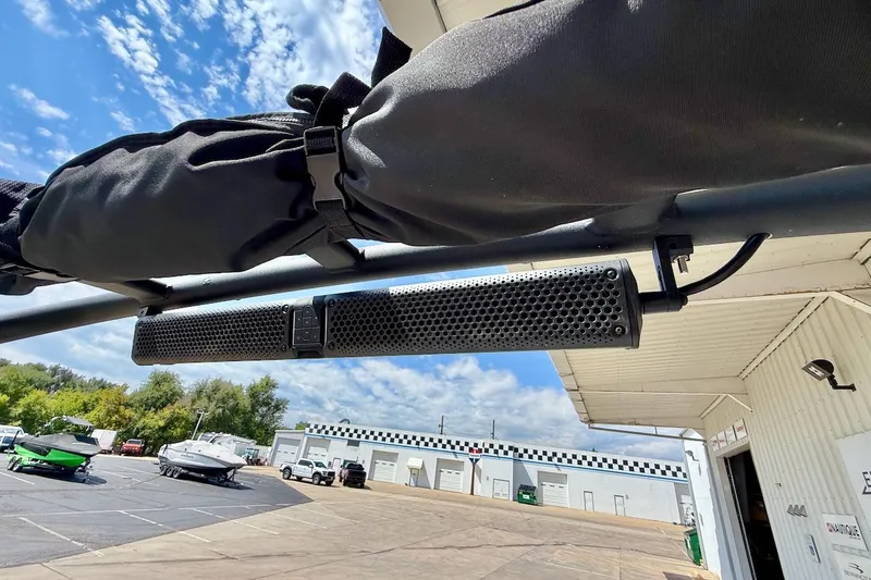 Slide: The Image of 2025 Yamaha Boats AR195 with mounted speaker, outdoor setting, clear sky. - 29