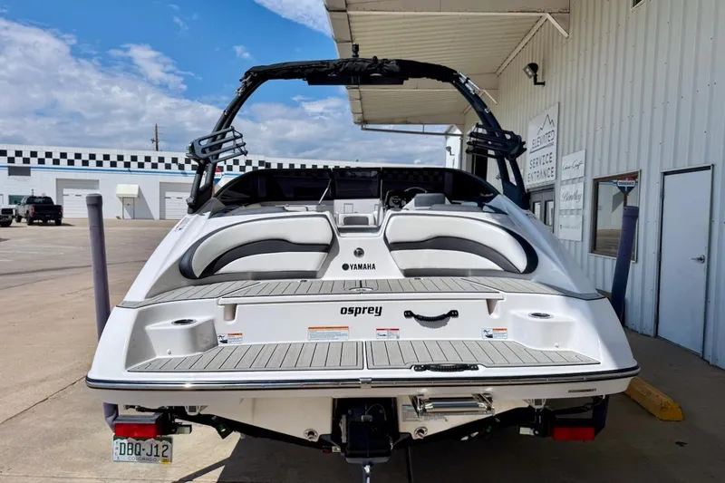 Slide: The Image of 2025 Yamaha Boats AR195 at a service entrance, showcasing sleek design and modern features. - 4