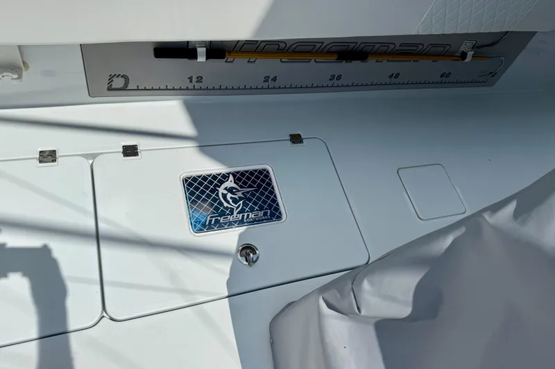 Slide: The Image of Freeman 34VH 2023 boat deck with logo and measurement scale. - 14