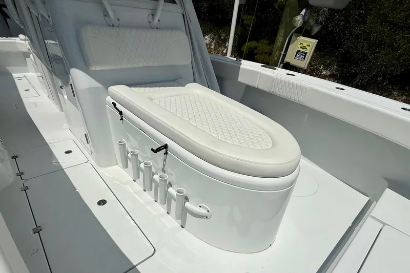 Slide: The Image of 2023 Freeman 34VH boat interior with cushioned seating and rod holders. - 25