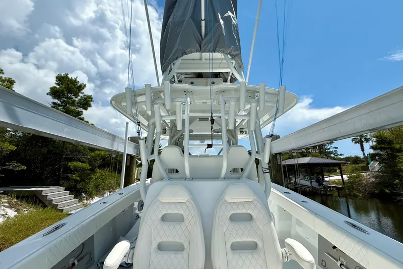 Slide: The Image of 2023 Freeman 34VH boat interior with white seating and fishing equipment. - 26