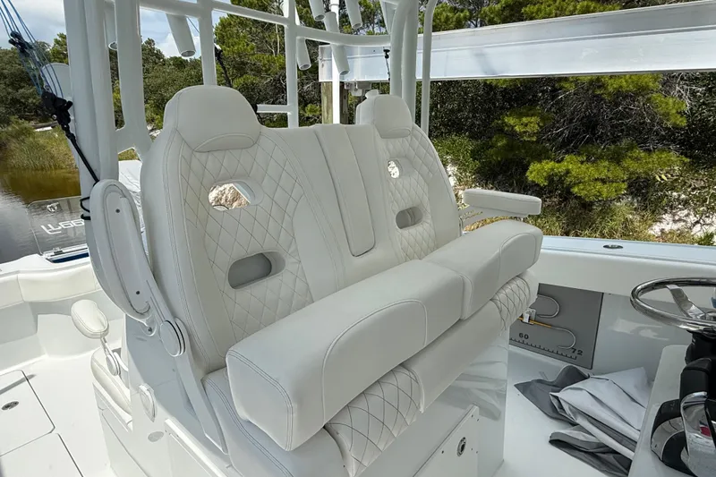 Slide: The Image of Luxurious seating on 2023 Freeman 34VH boat with quilted upholstery and armrests. - 27
