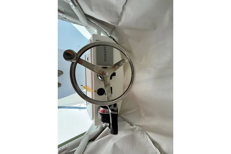Slide: The Image of Steering wheel of 2023 Freeman 34VH boat with Garmin navigation system. - 29