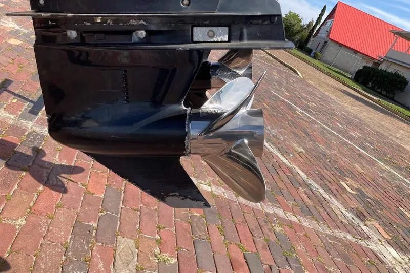 Slide: The Image of Close-up of a 2005 Donzi 35 ZF Daytona boat propeller on a brick surface. - 14