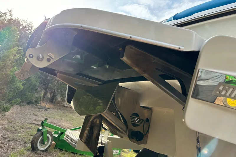 Slide: The Image of 2022 Malibu Wakesetter 23 MXZ boat underside, showcasing propeller and rudder details. - 21