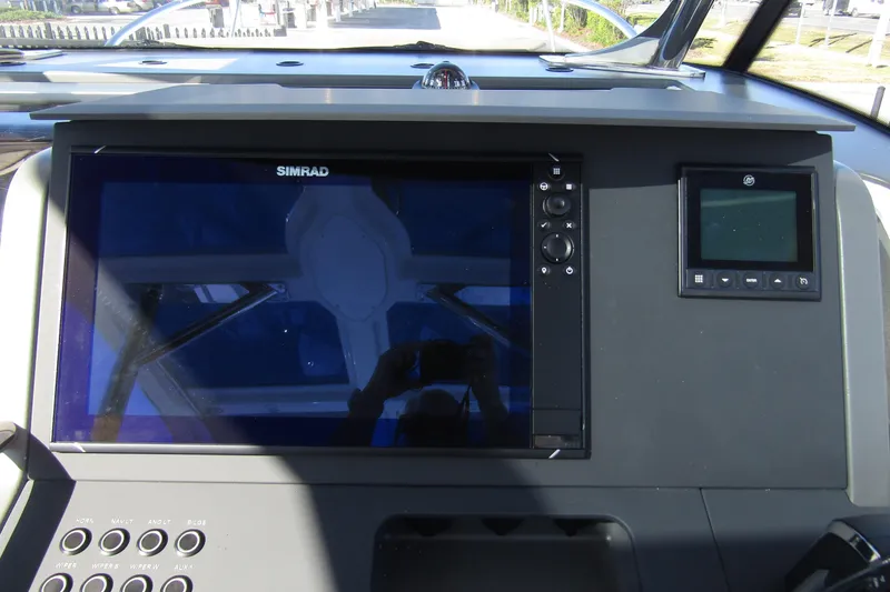 Slide: The Image of Control panel of 2025 Nimbus Tender 9 boat with Simrad display. - 17