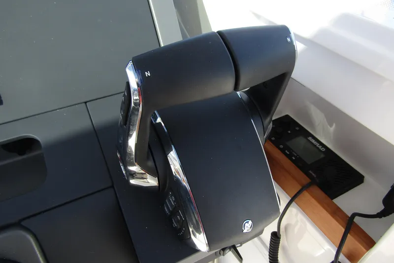 Slide: The Image of Throttle control of 2025 Nimbus Tender 9 boat, featuring sleek design and modern technology. - 22