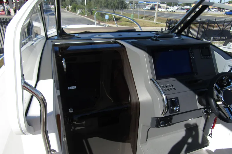 Slide: The Image of Interior view of a 2025 Nimbus Tender 9 boat cockpit with modern controls. - 25