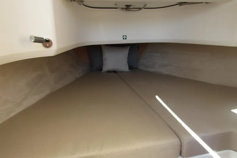 Slide: The Image of Cozy interior cabin of 2025 Nimbus Tender 9 with beige cushions and pillow. - 29