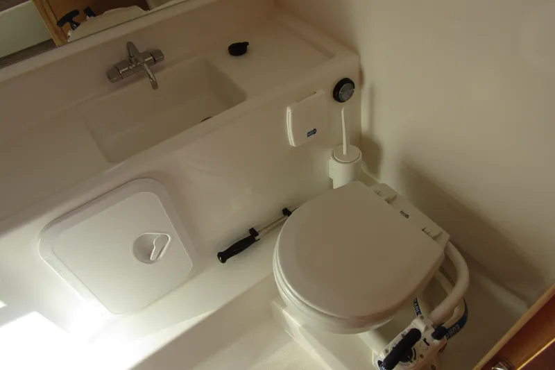 Slide: The Image of 2025 Nimbus Tender 9 boat bathroom with sink and toilet. - 32
