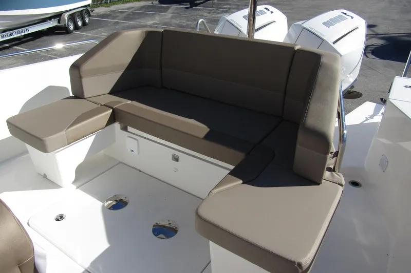 Slide: The Image of Luxurious seating on 2025 Nimbus Tender 9 boat, featuring comfortable brown cushions. - 35