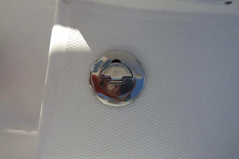 Slide: The Image of Chrome fuel cap on 2025 Nimbus Tender 9 boat deck. - 48