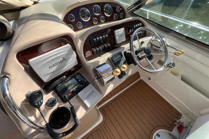 Slide: The Image of 2002 Sea Ray 360 Sundancer Helm with Electronics Covers on - 13