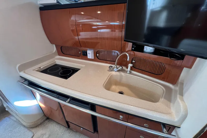 Slide: The Image of 2002 Sea Ray 360 Sundancer Galley with Cooktop and Sink covers off - 20