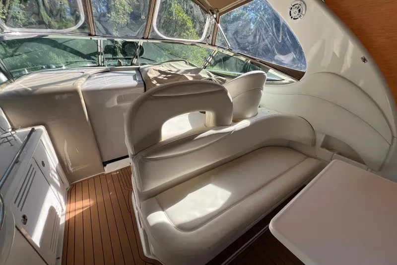 Slide: The Image of 2002 Sea Ray 360 Sundancer aft seating looking forward toward helm - 9