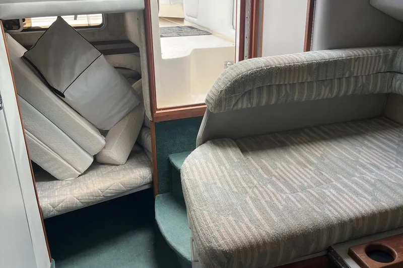 Slide: The Image of Interior of 1991 Sea Ray 270 Sundancer with cushions and seating area. - 5